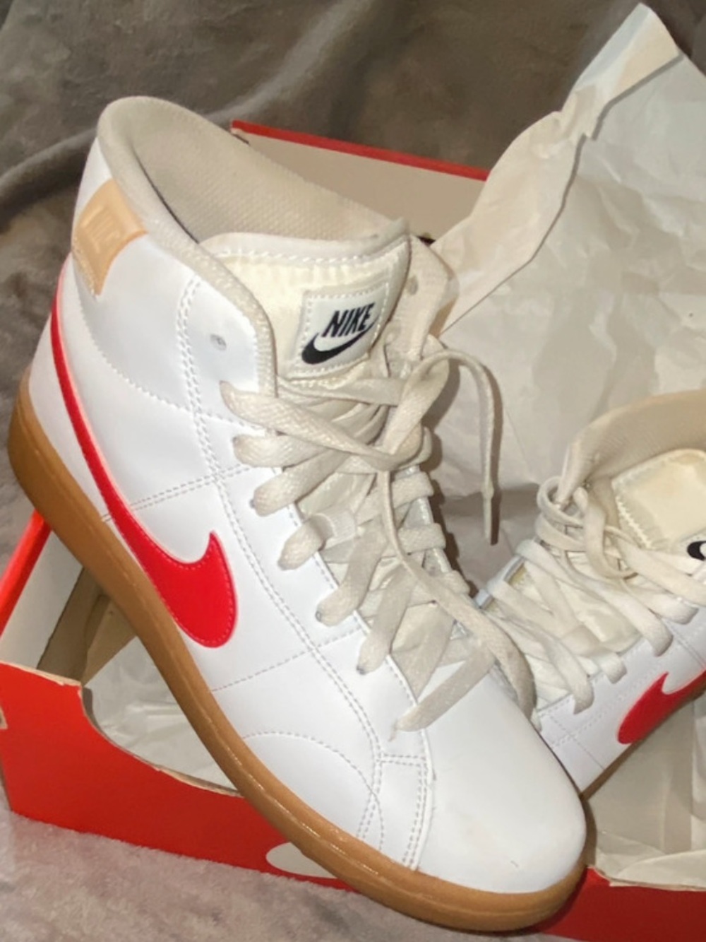Nike White High-Top Sneakers with Red Swoosh and Gum Sole